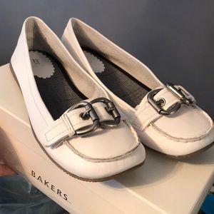 Brand new white flats with silver buckle.
